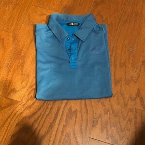 North face blue golf shirt.